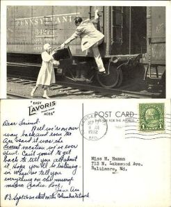 postcard of the Aces hopping a freight car